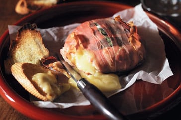 Prosciutto-wrapped baked camembert